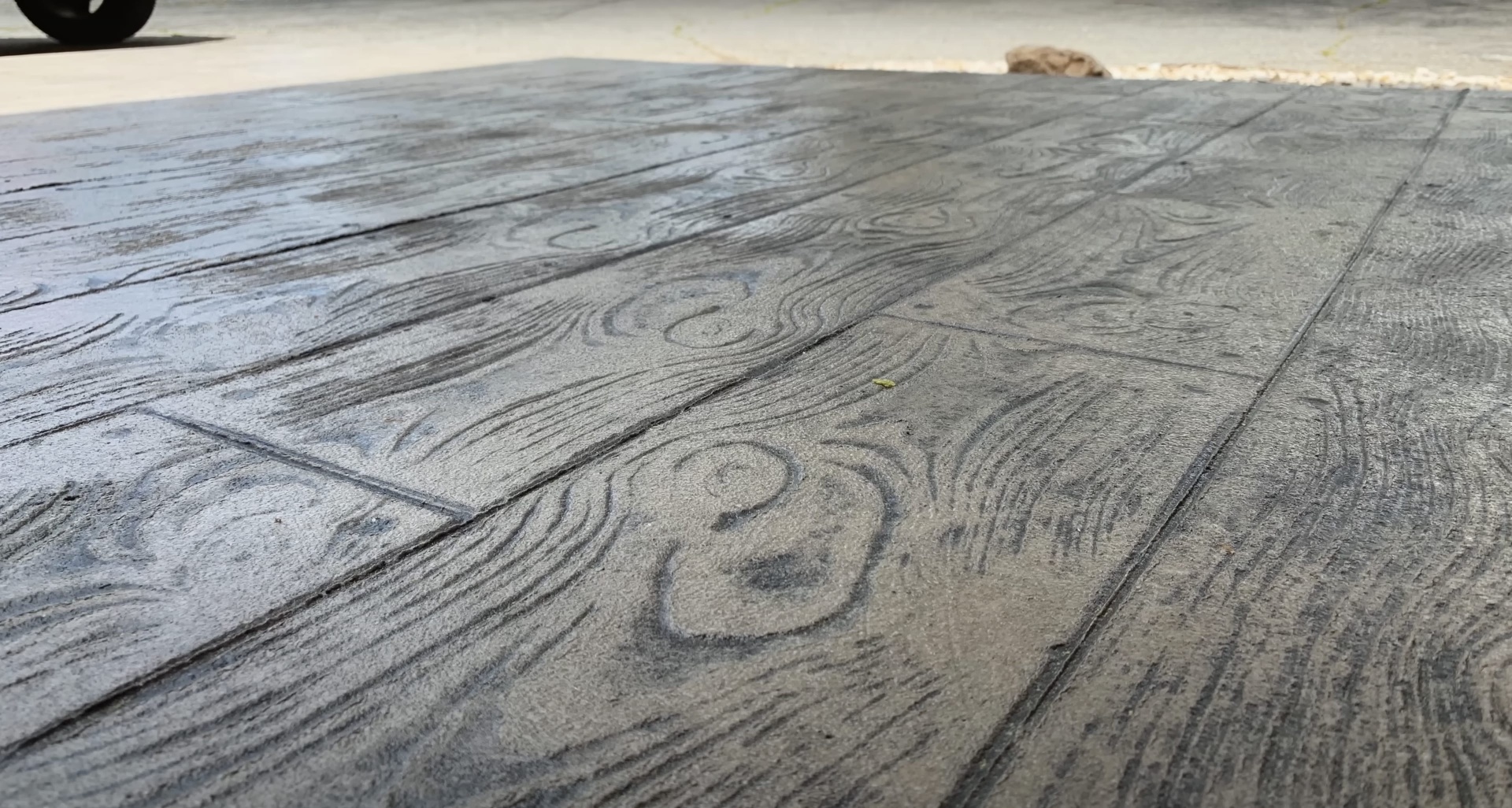Beautiful stamped concrete with realistic wood grain texture Stamped decorative concrete with wood grain pattern installed by professional contractors
