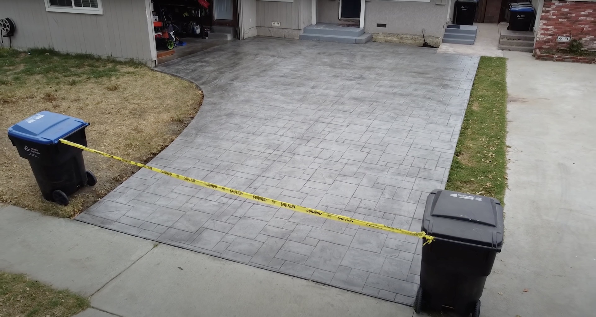 Beautiful stamped concrete patio with decorative paver design Stamped concrete patio with decorative paver pattern in residential setting