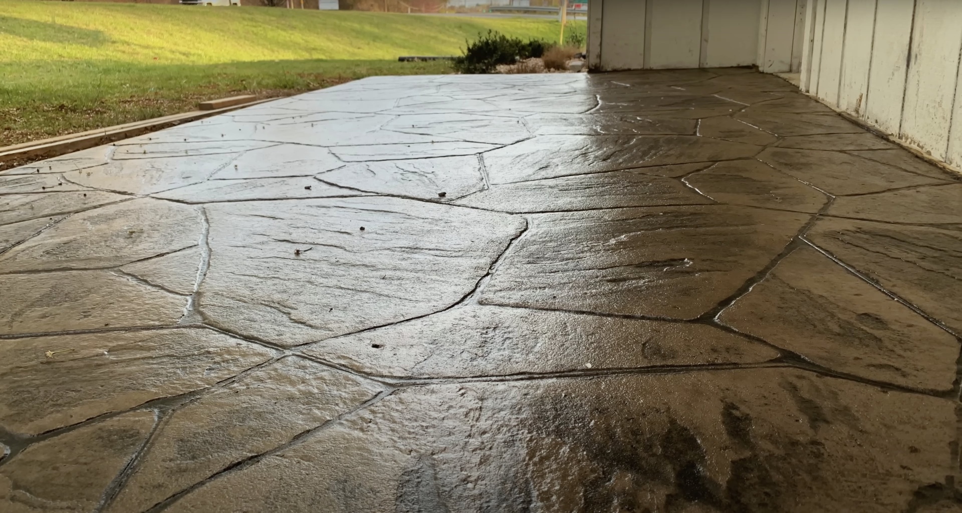 Damaged concrete driveway requiring professional repair services Cracked concrete driveway showing damage before repair by Cuyahoga Falls Concrete